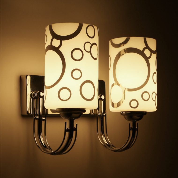 Elegant designer wall light illuminating a modern living space, showcasing its unique artistic design.