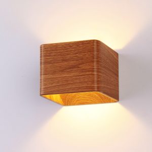 Sleek square LED indoor wall lamp providing bright illumination in a modern living room.