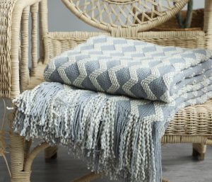 Embrace the timeless charm of our Nordic Knitted Decorative Blanket. Featuring a classic Nordic pattern, this blanket adds a touch of sophisticated style to any room.