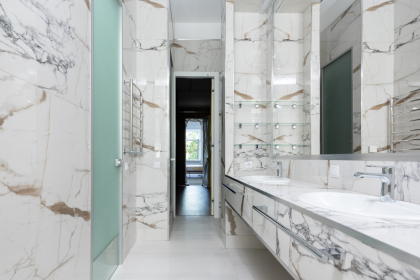 Modern bathroom vanity with a dark wood finish, contrasting white sink, and clean lines for a sophisticated look.