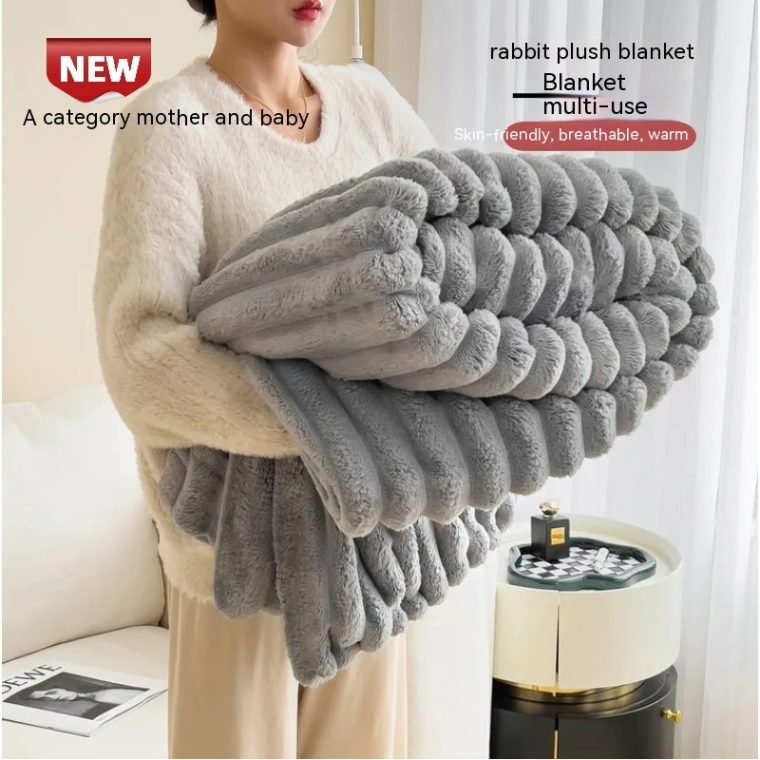 Warm and elegant Soft Wind Bubble Velvet Fur Blanket on a neatly made bed.