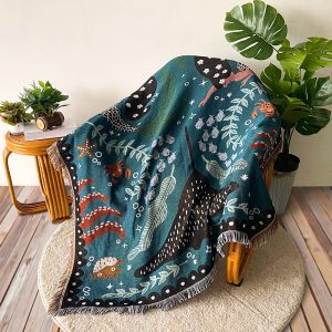 Boho Sofa Blanket Tapestry with intricate bohemian patterns draped over a cozy sofa.